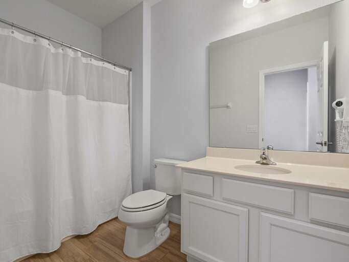 Bathroom with bathtub and shower combo