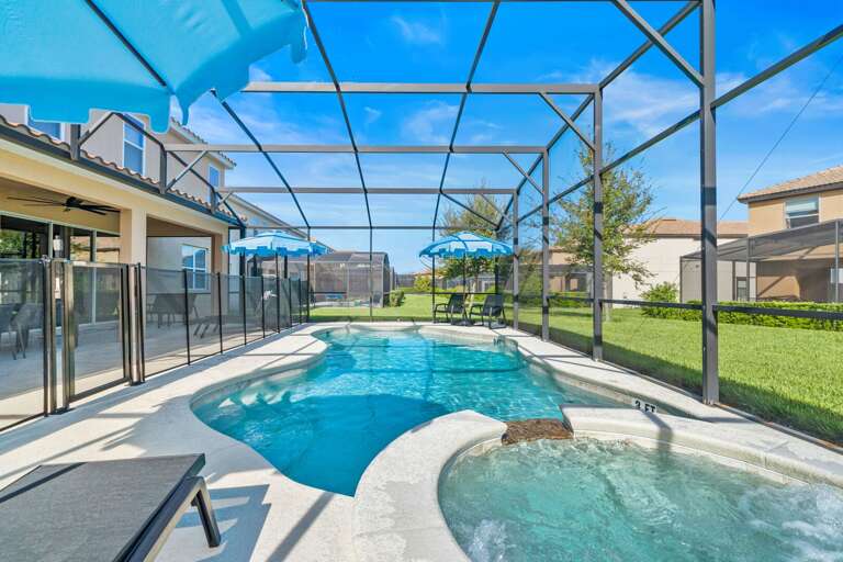 - Covered patio with lounge seating and outdoor dining tables  
- Relax with ceiling fans and poolside access in screened area  
- Orlando villa offering outdoor dining and family gathering