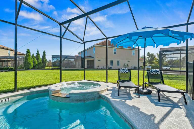 - Covered patio with lounge seating and outdoor dining tables  
- Relax with ceiling fans and poolside access in screened area  
- Orlando villa offering outdoor dining and family gathering