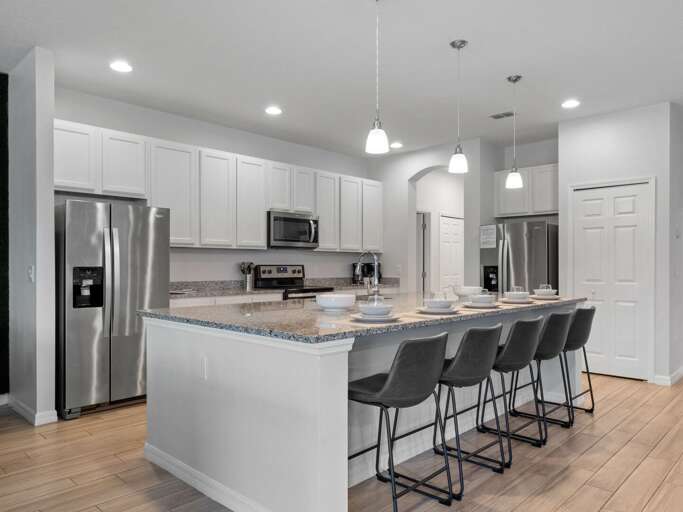 Kitchen area with stainless steel appliances and spacious island