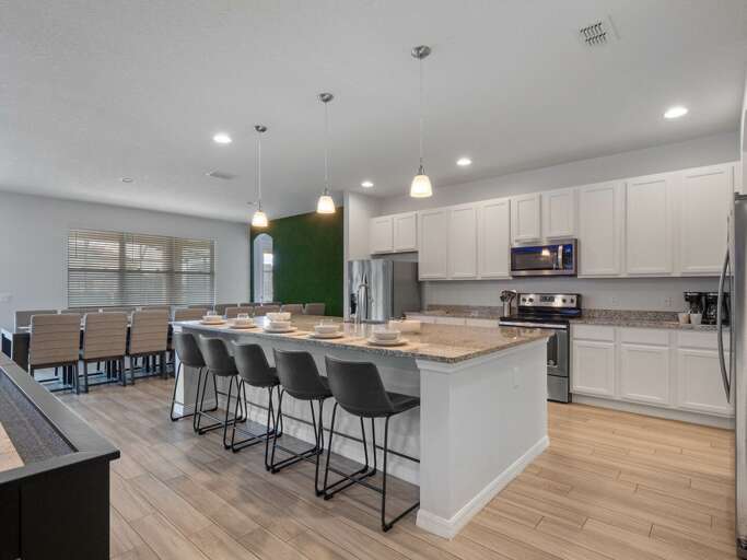 Kitchen area with stainless steel appliances and spacious island