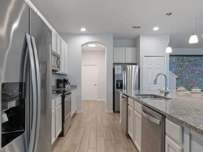 Kitchen area with stainless steel appliances and spacious island