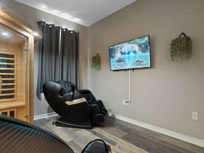 Relax room with massage chairs and TV