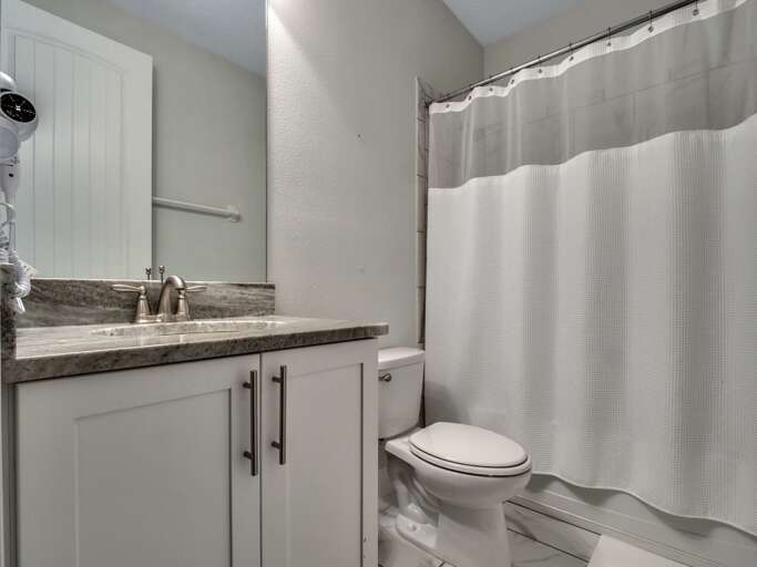 Bathroom with bathtub and shower combo