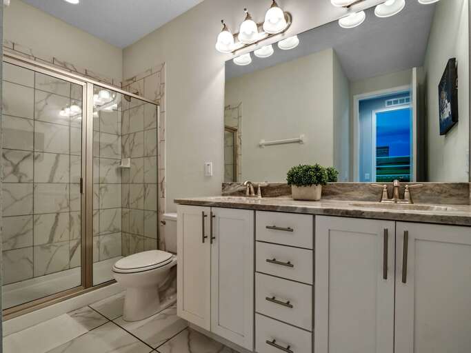 Bathroom with glass enclosed shower