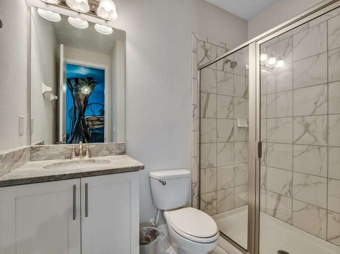Bathroom with glass enclosed shower