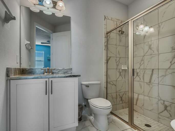 Bathroom with glass enclosed shower