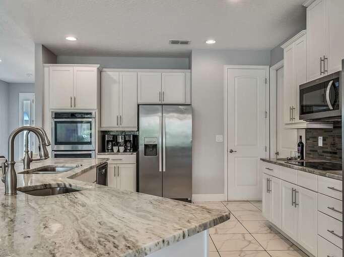 Kitchen area with stainless steel appliances and spacious island