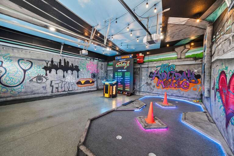 - Mini golf zone with graffiti style walls neon lights and fun decor  
- Unique vacation rental - Mini golf zone with graffiti style walls neon lights and fun decor  
- Unique vacation rental