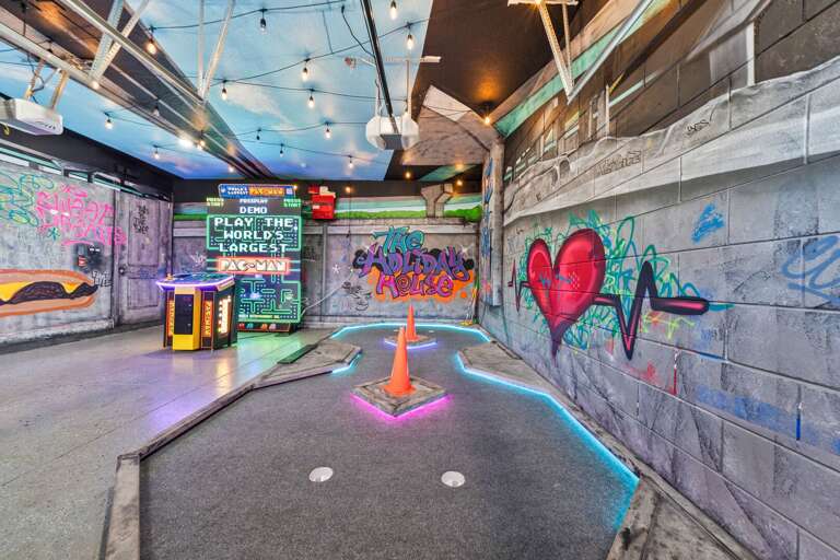 - Mini golf zone with graffiti style walls neon lights and fun decor  
- Unique vacation rental - Mini golf zone with graffiti style walls neon lights and fun decor  
- Unique vacation rental
