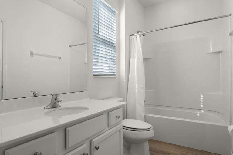 Bathroom with bathtub and shower combo Bathroom with bathtub and shower combo
