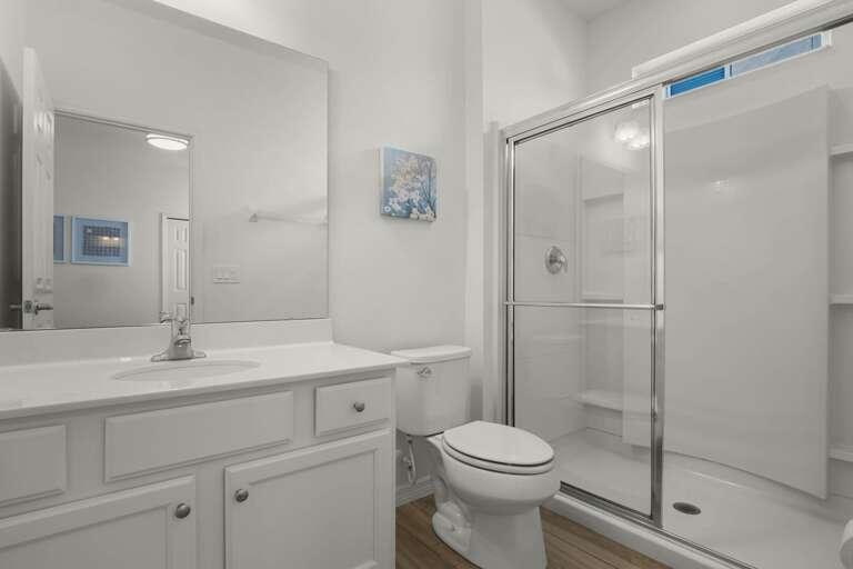 Bathroom with glass enclosed shower Bathroom with glass enclosed shower