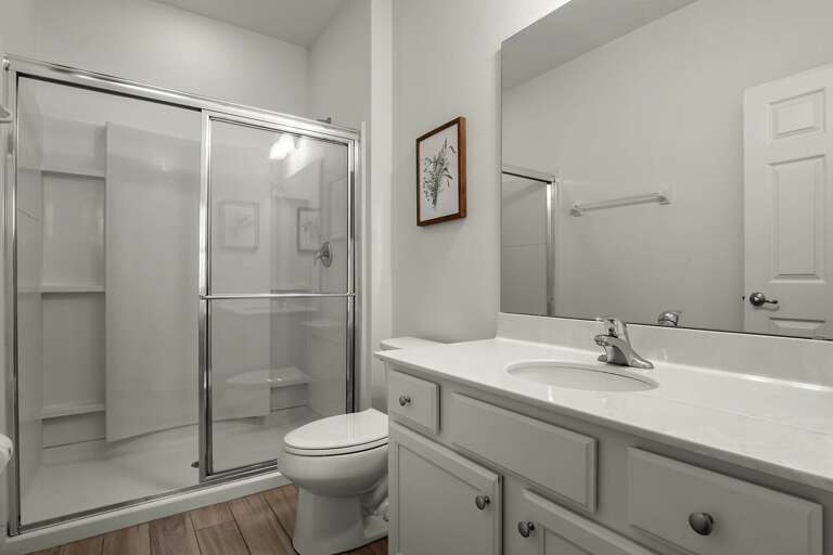 Bathroom with glass enclosed shower Bathroom with glass enclosed shower
