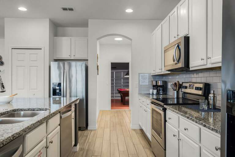 Kitchen area with stainless steel appliances and spacious island Kitchen area with stainless steel appliances and spacious island
