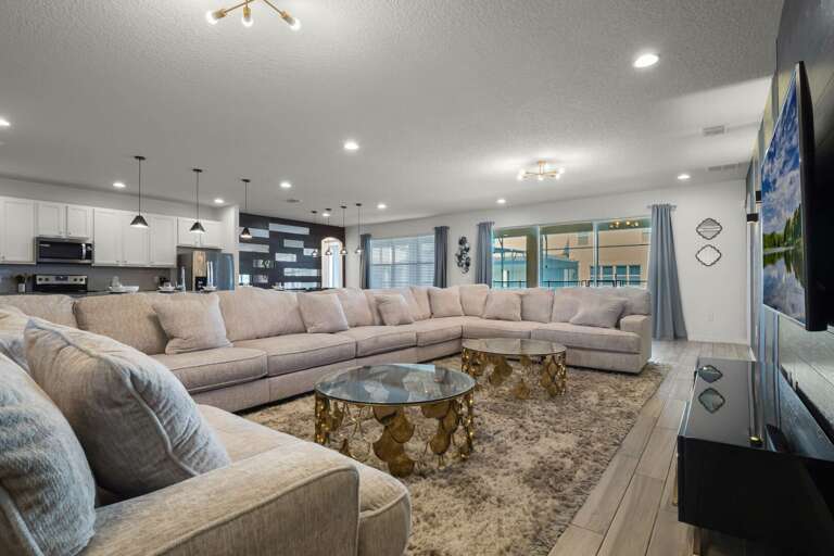 Living area with oversized sectional sofa and flat screen TV Living area with oversized sectional sofa and flat screen TV