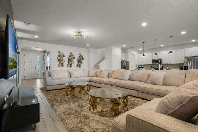 Living area with oversized sectional sofa and flat screen TV Living area with oversized sectional sofa and flat screen TV
