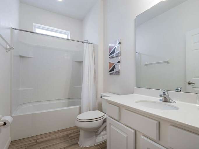 Bathroom with bathtub and shower combo