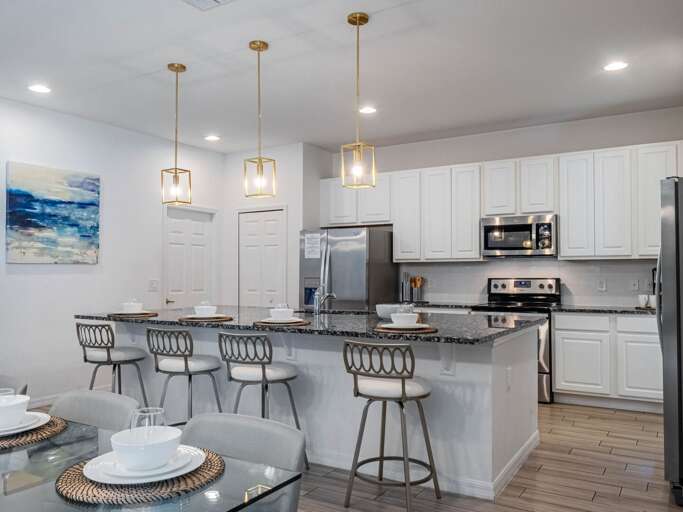 Kitchen area with stainless steel appliances and spacious island