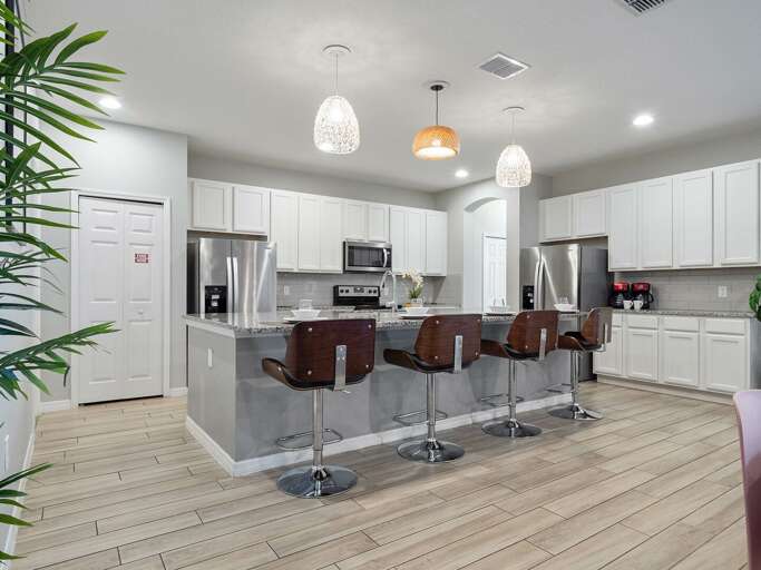 Kitchen area with stainless steel appliances and spacious island