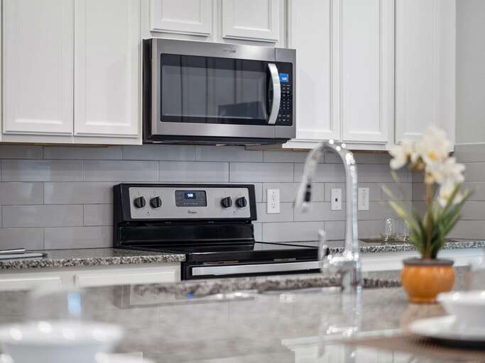 Kitchen area with stainless steel appliances and spacious island