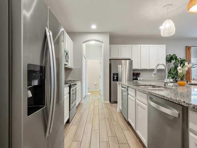 Kitchen area with stainless steel appliances and spacious island