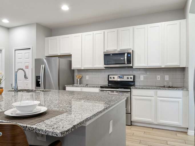 Kitchen area with stainless steel appliances and spacious island