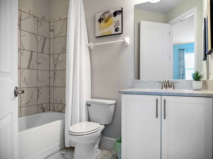 Bathroom with bathtub and shower combo Bathroom with bathtub and shower combo