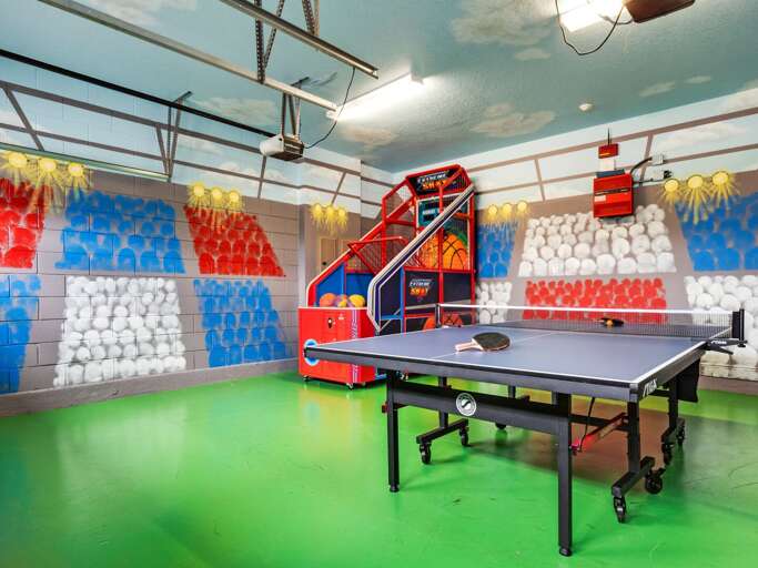 Game room with basketball arcade and ping pong table Game room with basketball arcade and ping pong table