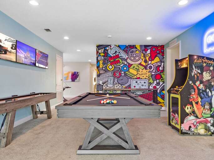 Game room with pool table, shuffleboard, giant scrabble, and arcade