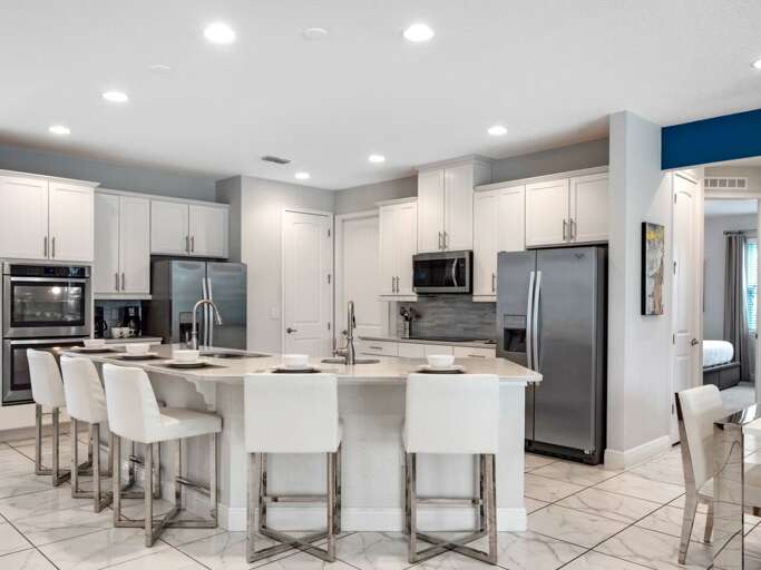 Kitchen area with stainless steel appliances and spacious island Kitchen area with stainless steel appliances and spacious island