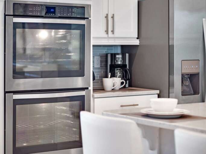 Kitchen area with stainless steel appliances and spacious island Kitchen area with stainless steel appliances and spacious island
