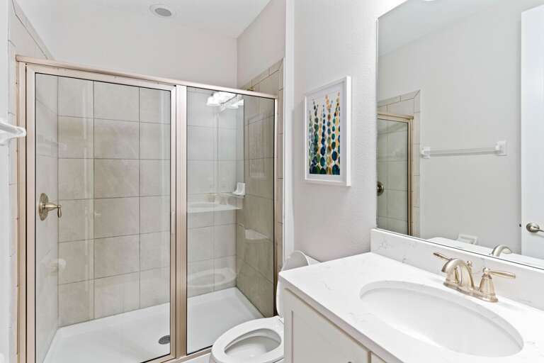 Bathroom with glass enclosed shower