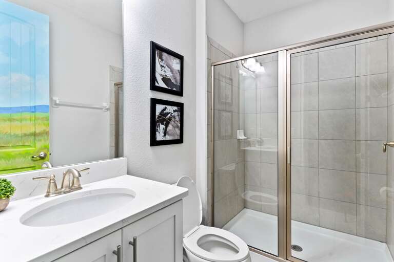 Bathroom with glass enclosed shower