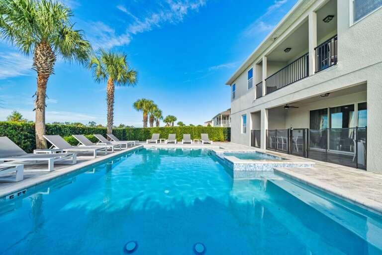 - Large private pool with multiple lounge chairs  
- Relax under palm trees in a sun-soaked setting  
- Perfect for swimming and enjoying warm vacation days