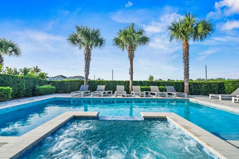 - Large private pool with multiple lounge chairs  
- Relax under palm trees in a sun-soaked setting  
- Perfect for swimming and enjoying warm vacation days