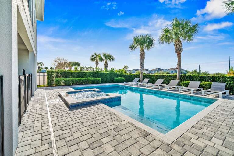 - Large private pool with multiple lounge chairs  
- Relax under palm trees in a sun-soaked setting  
- Perfect for swimming and enjoying warm vacation days