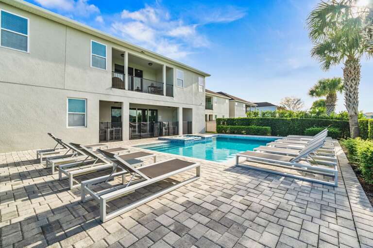 - Large private pool with multiple lounge chairs  
- Relax under palm trees in a sun-soaked setting  
- Perfect for swimming and enjoying warm vacation days