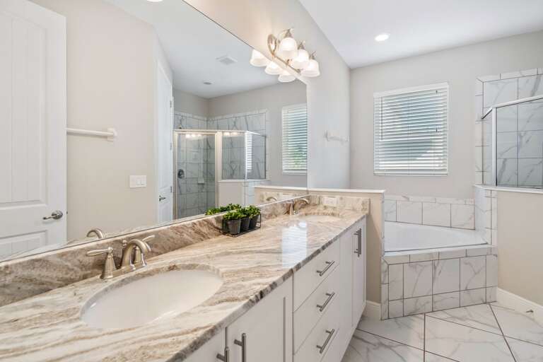 Bathroom with dual sinks and jetted tub Bathroom with dual sinks and jetted tub