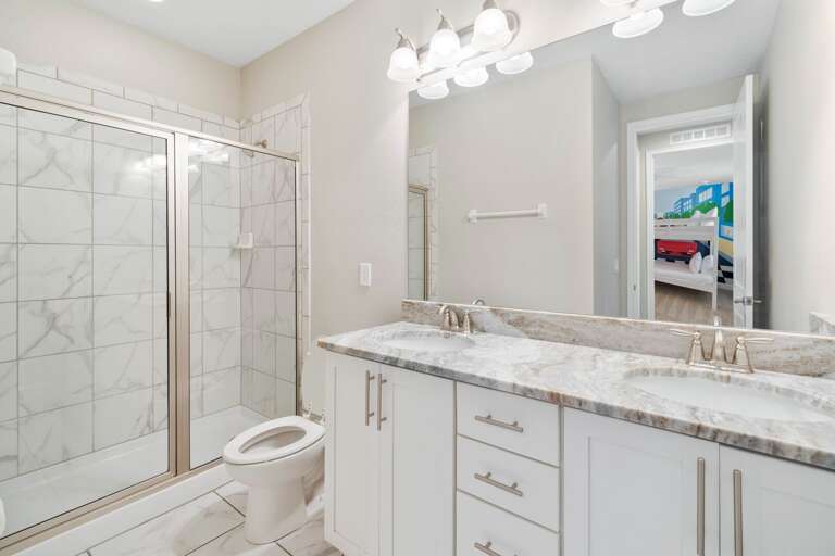 Bathroom with glass enclosed shower Bathroom with glass enclosed shower