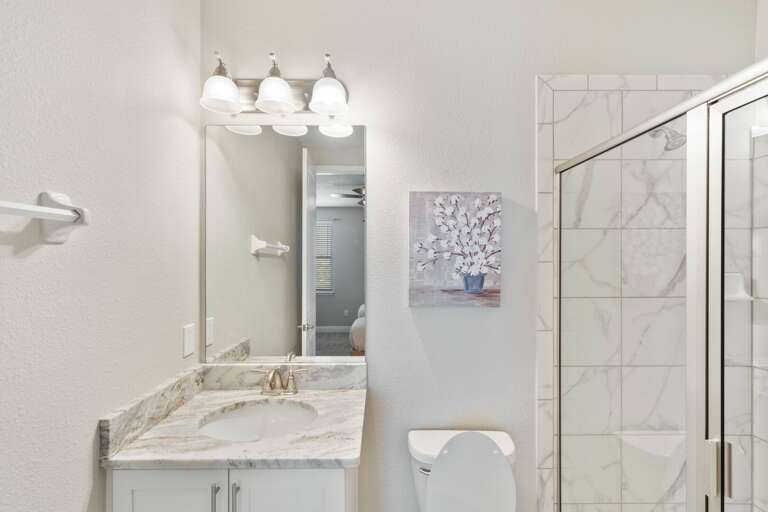 Bathroom with glass enclosed shower