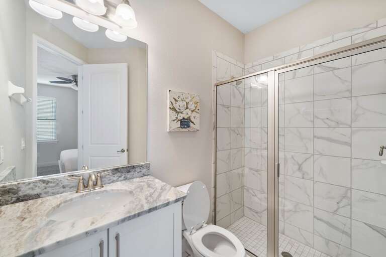 Bathroom with glass enclosed shower Bathroom with glass enclosed shower