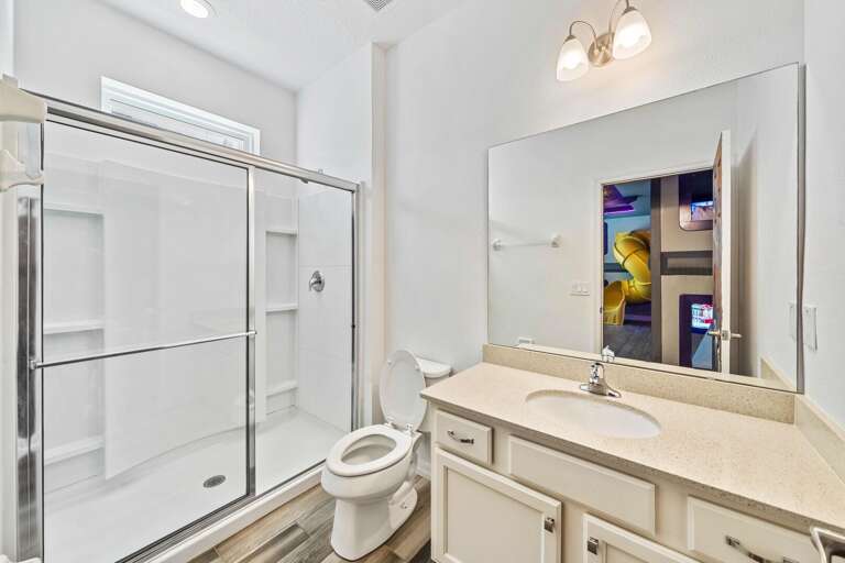 Bathroom with glass enclosed shower