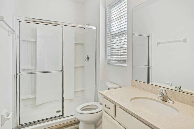Bathroom with glass enclosed shower