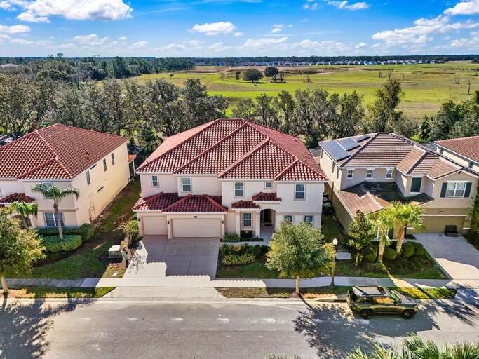 Aerial View Of A Spacious Suburban House Nestled Near Nature Aerial View Of A Spacious Suburban House Nestled Near Nature