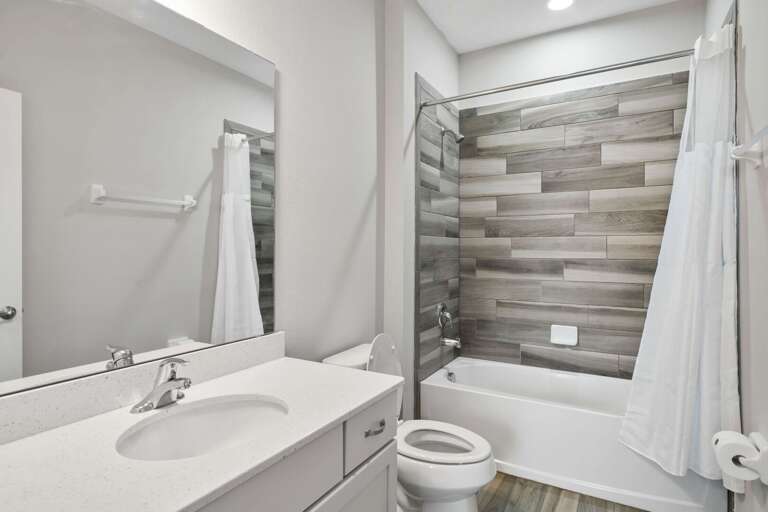 Bathroom with bath and shower combo