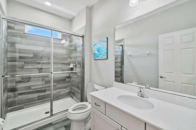 Bathroom with glass enclosed shower
