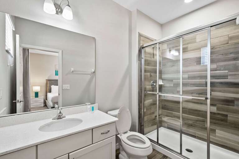 Bathroom with glass enclosed shower