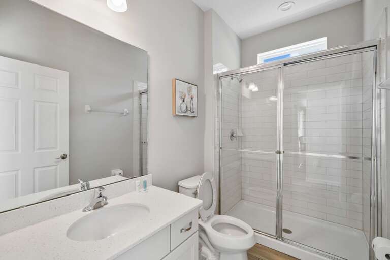 Bathroom with glass enclosed shower