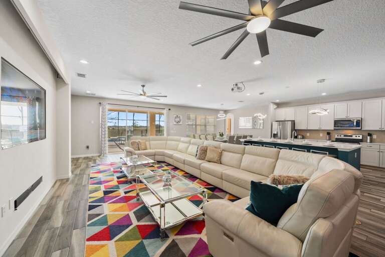 Living area with huge sofa and flat screen TV