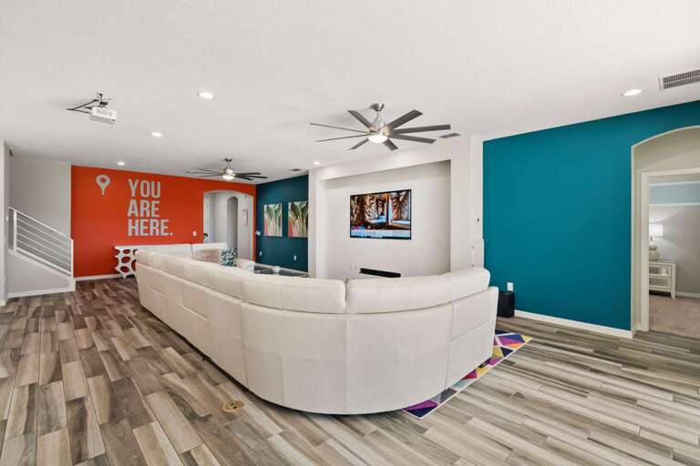 Living area with huge sofa and flat screen TV